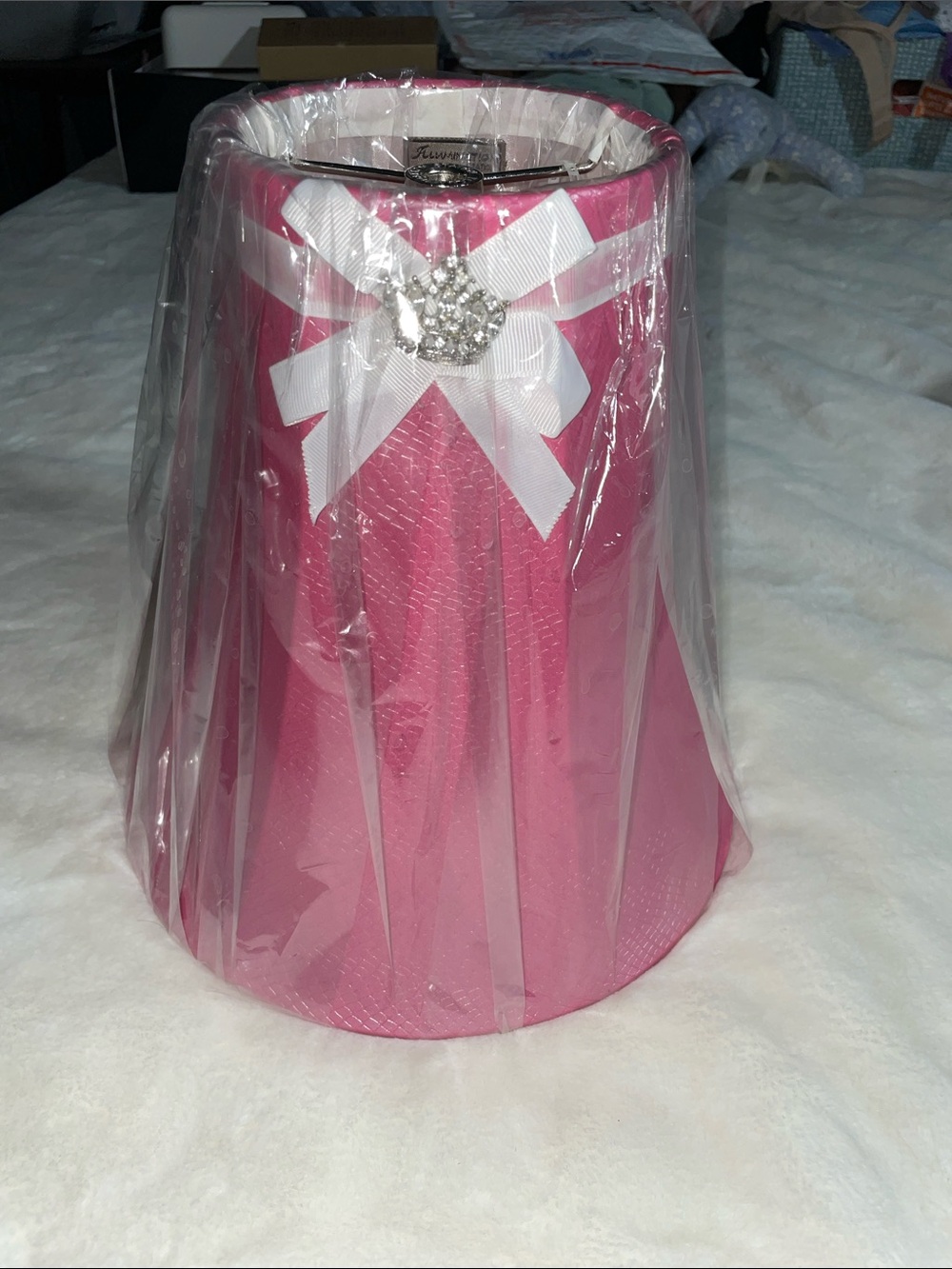 Illumination Station pink textured bell lampshade with white ribbon/crown accent